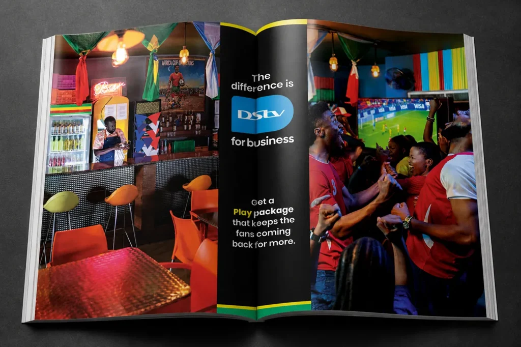 Open magazine advert promoting DStv for business sports viewing